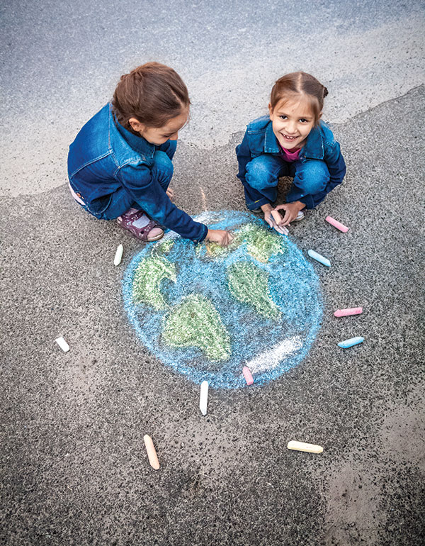 2 girls with chalk globe